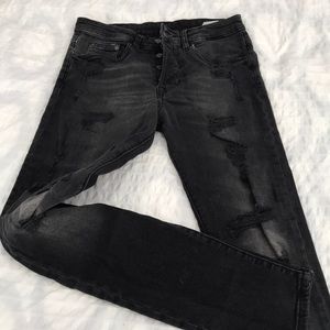H&M’s black distressed skinny jeans